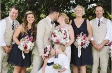 The wedding photographer said 'kiss'... and the flower girl did just that