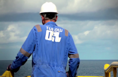 An Irish oil company has agreed to a €220 million tax bill to Uganda