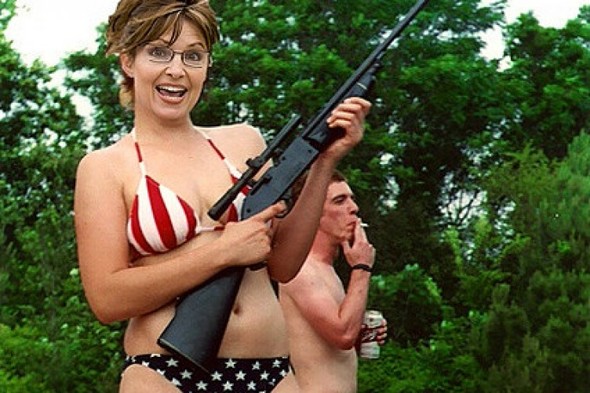 No, Sarah Palin wasn’t really toting a firearm in an American-flag bikini. 