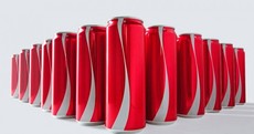 Coke is removing logos from its packaging to try to make you a better person