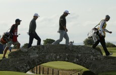 Johnson battles conditions to lead while Tiger misses another major cut