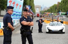 Paris police fire on car driven through Tour de France barrier