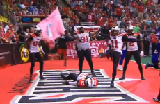 American football team celebrate with a glorious recreation of 'The People's Elbow'