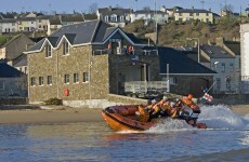 Father and son rescued after being swept away in dinghy