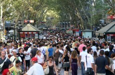 Manhunt in Barcelona as two injured in gun attack on main tourist street