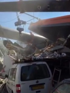 WATCH: At least 20 people injured after cranes collapse on to houses