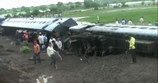 Photos show extent of devastating train derailment that killed dozens