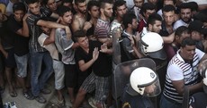 Riot police sent to island after 1,000 locked in football stadium in Kos