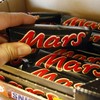 A woman fined for stealing a Mars bar has been given nearly €20,000 to pay it