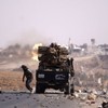 Libyan forces pull back after fierce battles in Gaddafi's hometown
