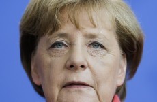 Merkel vows zero tolerance for migrant hate - as 55 bodies found on boats