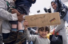 The Syrian father pictured crying with his family in Kos has reached Germany