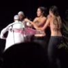 Topless protesters pulled from stage at Muslim religious conference