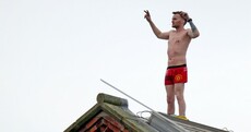 Crowd holds street party for inmate who's been on prison roof for three days