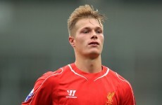 An Irish teenager has made the bench for Liverpool tonight