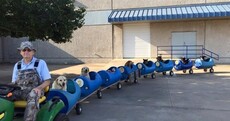 The internet has fallen in love with this old man who built a 'dog train' for rescued pups