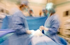 Doctor accused of 'inappropriate' womb removals breaks down during testimony