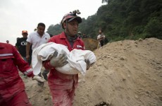 Families receive text messages from trapped relatives after 30 people killed by landslide
