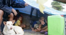 Teenage boy crushed to death as typhoon in Philippines forces thousands to flee