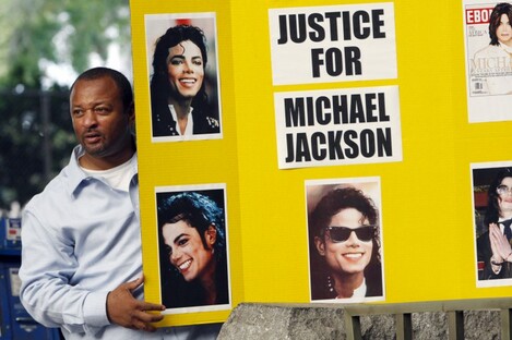 An activist demonstrating outside the LA court earlier this month