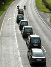 A final farewell: As the bells tolled, five coffins were taken from the hearses