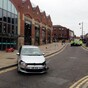 Two children injured after pensioner drives onto pavement