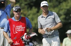 Johnson denies any friction with Woods over caddie move