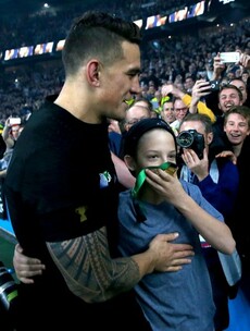 Holy SBW!  Sonny Bill just offloaded his World Cup medal to this lucky kid