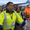 Airport staff welcome All Blacks home with Haka on the runway