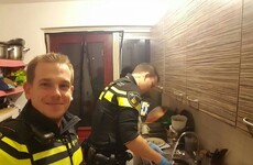 A photo of two dotey policemen washing dishes is going viral for a very good reason