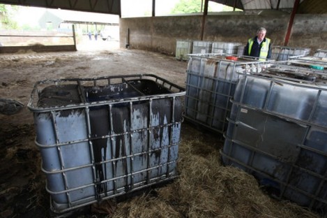 Containers of sludge at a fuel laundering plant. File photo. 