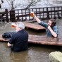 These two guys just kept on drinking even though the pub's beer garden was flooded