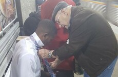 This lovely photo of an elderly couple helping a young man tie his tie is going viral