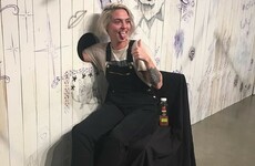 People stuck their arms through a hole and let an artist give them 'mystery tattoos'