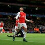 Goals from Özil and Sanchez keep Gunners' Champions League hopes alive
