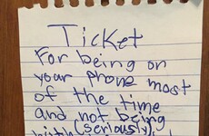 This little kid just wrote his Mam a 'ticket' for being on her phone too much