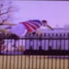 White House goes into lockdown after a man wearing a USA flag hops the fence