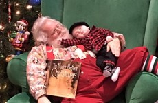 A little boy fell asleep before seeing Santa but they took the photo anyway