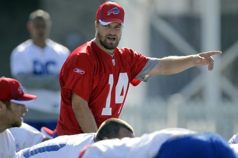 Buffalo Bills quarterback Ryan Fitzpatrick signals during a training session.