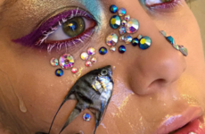 This makeup artist is sticking dead fish to her face