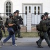 Bombs and thousands of bullets found at California shooting suspects' house