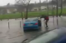 This Waterford lad's method of getting to his car in a flood is heroic