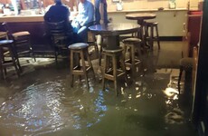 Photo: Two Cork lads sip pints as Storm Frank floods the pub around them