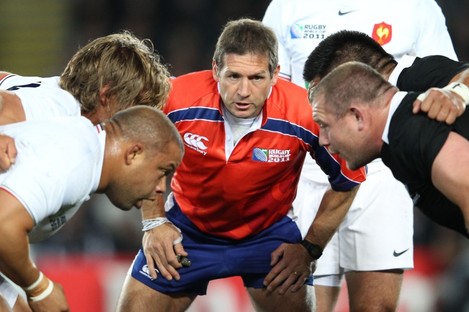 Alain Rolland keeps a close eye on the France and New Zealand front rows.