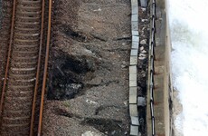 Sinkholes appear beneath train track in England as seawall begins to collapse