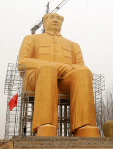 This gargantuan gold statue of Chairman Mao would fit a bus in its pocket