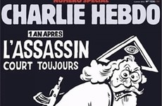 Vatican hits out at Charlie Hebdo for showing God carrying an assault rifle