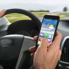 Using WhatsApp, Twitter or Facebook while driving hasn't been completely outlawed yet