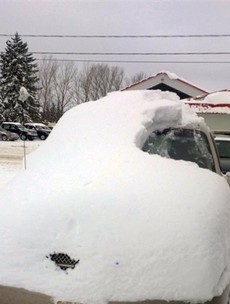 Canadian man charged after driving a car almost entirely buried in snow