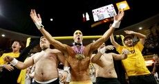 What is Michael Phelps doing in a pair of gold Speedos at a basketball game?